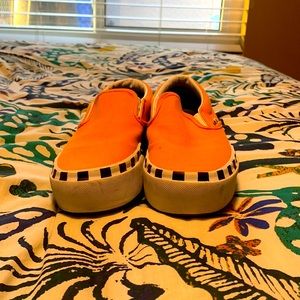 Orange platform slip-ons vans